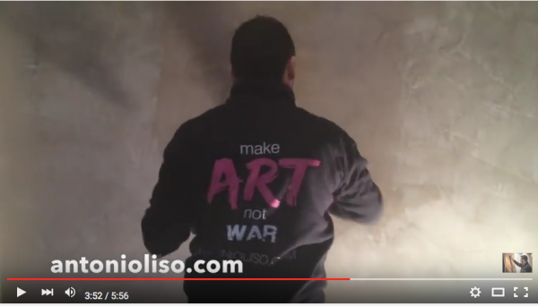 Man putting plaster on a wall, video still