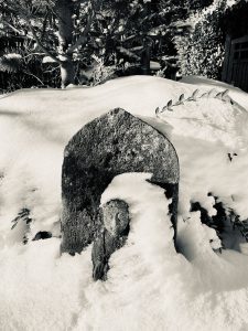 Kuan Yin statue in garden in snow