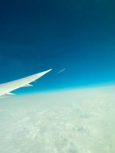 Airplane wing and contrail photo by Iskra